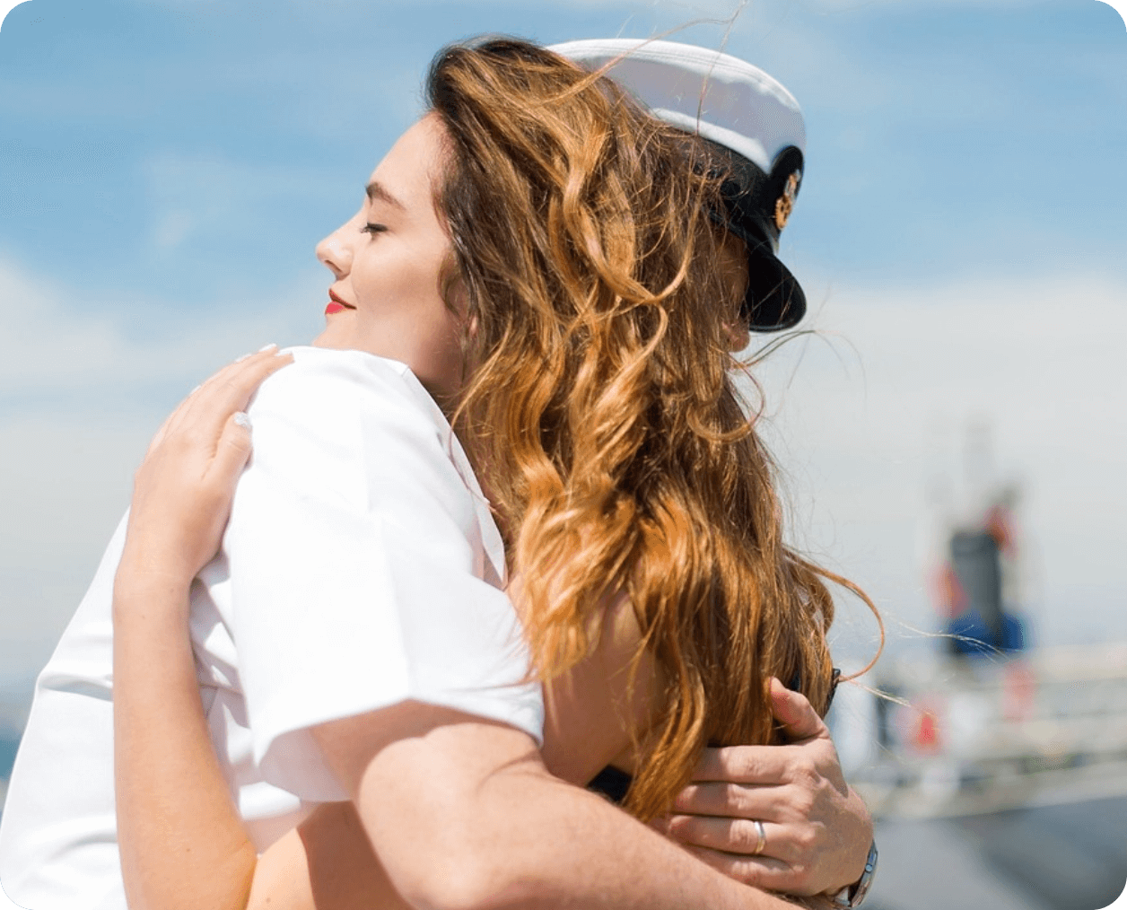 sailor hugging wife at the veterans recovery program
